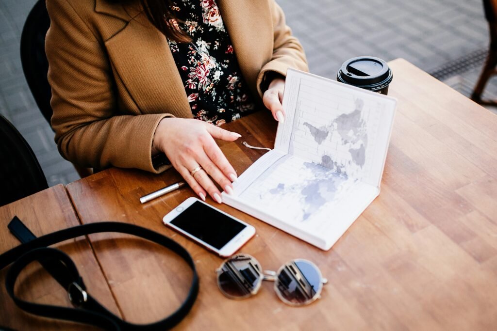 a modern map showing by a younger woman looking over her location